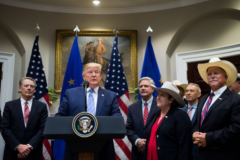 Donald Trump announces a beef trade agreement at the White House alongside cattle-industry representatives wearing cowboy hats