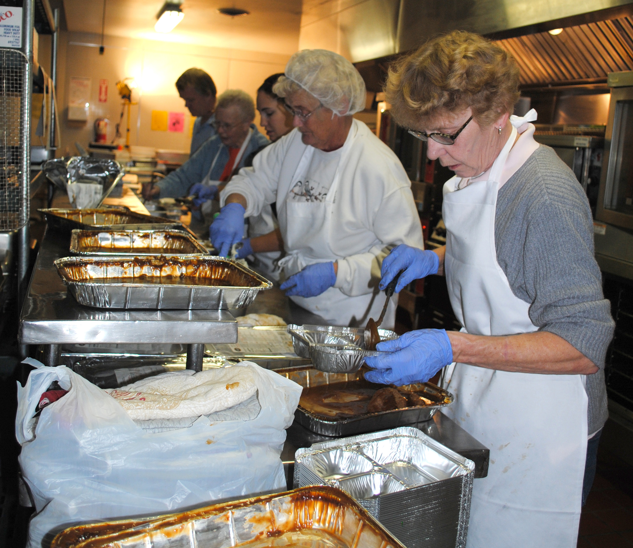 Meals on Wheels food preparation at the Great Falls Community Food Bank in Montana, November 2011. Archival program context; this is not Rasmussen Senior Center, its kitchen or its staff.