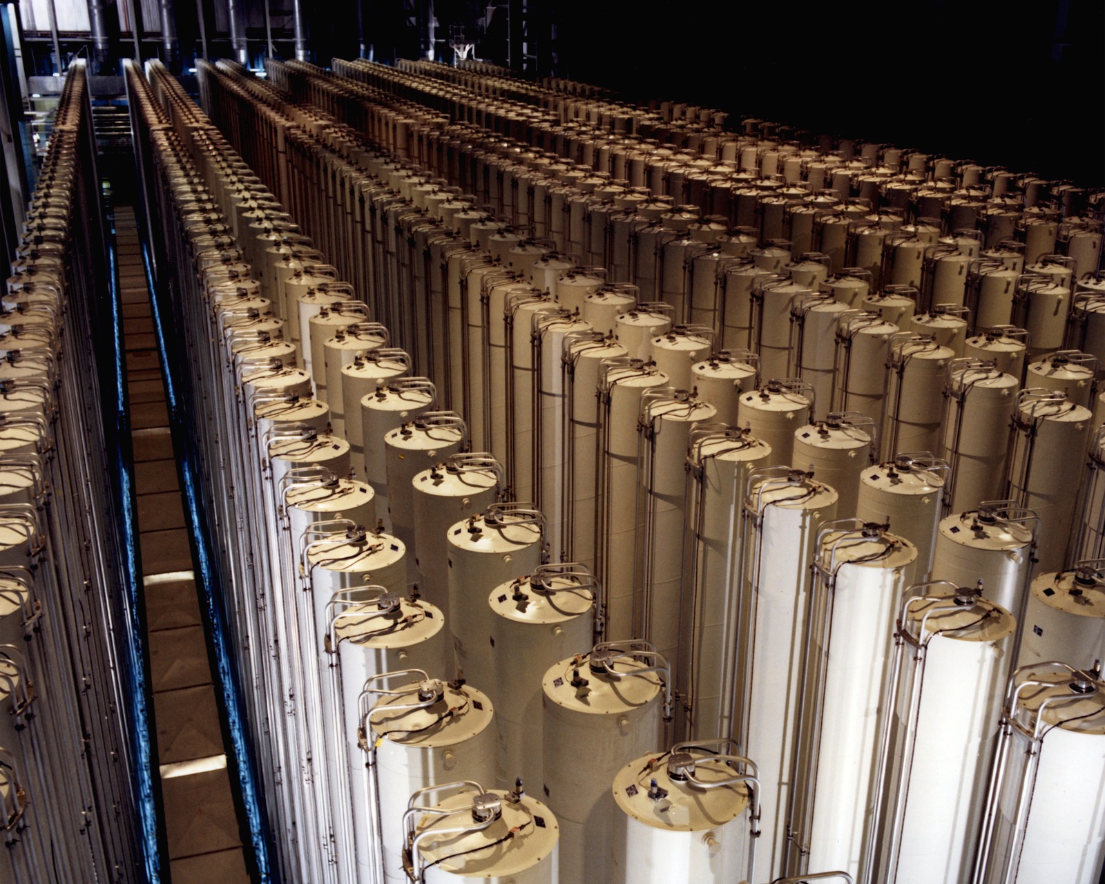 Rows of tall cylindrical gas centrifuges inside the Piketon, Ohio, enrichment plant in a 1984 Department of Energy photograph.