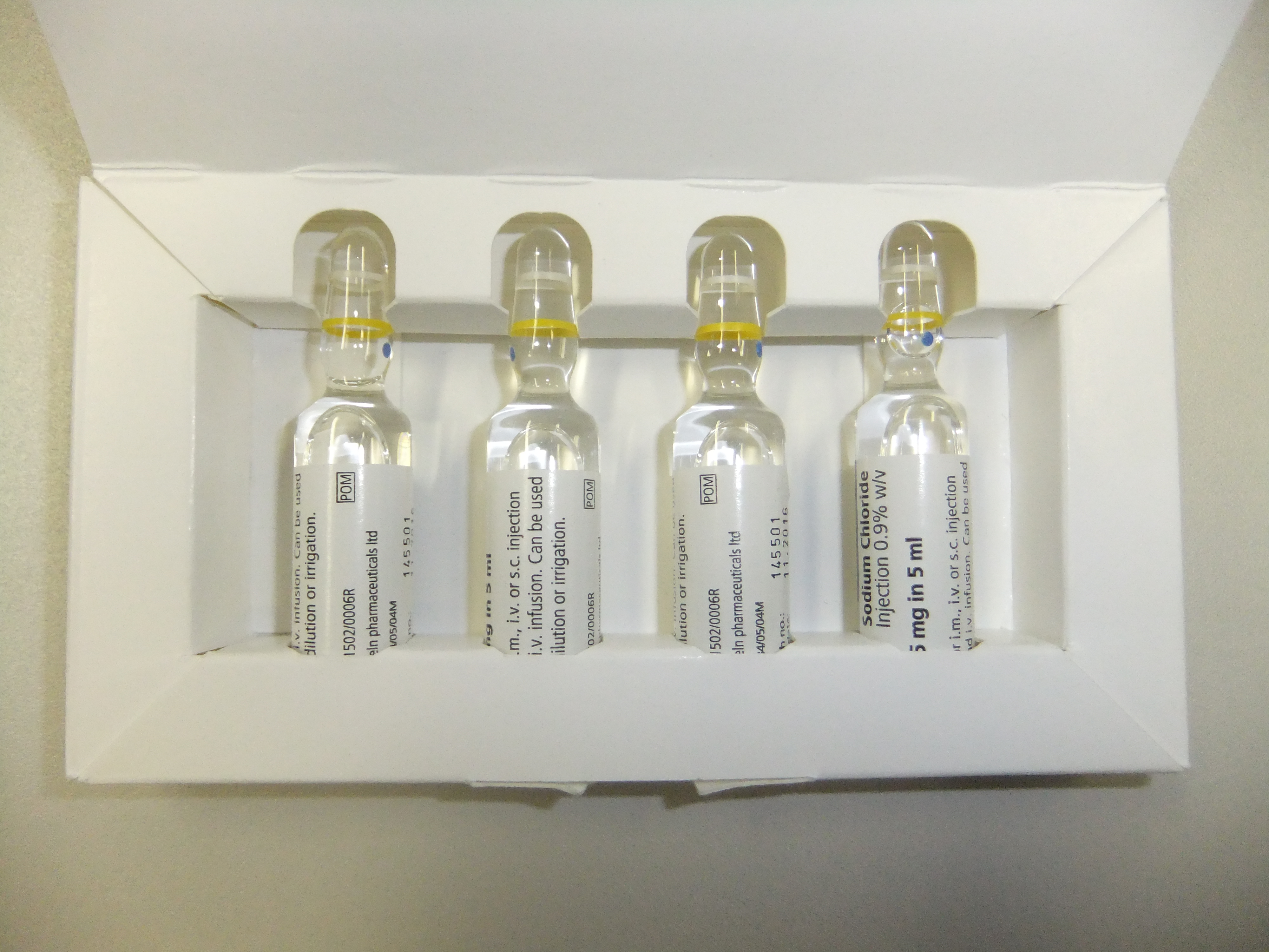 Sodium-chloride injection ampoules photographed December 18, 2012. Injectable-product packaging context; these are not identified as the drugs or price submissions analyzed in the Medicare report. Photo: Lee Haywood / Wikimedia Commons, CC BY-SA 2.0. Source: https://commons.wikimedia.org/wiki/File:Drug_vials_(8398232857).jpg License: https://creativecommons.org/licenses/by-sa/2.0/