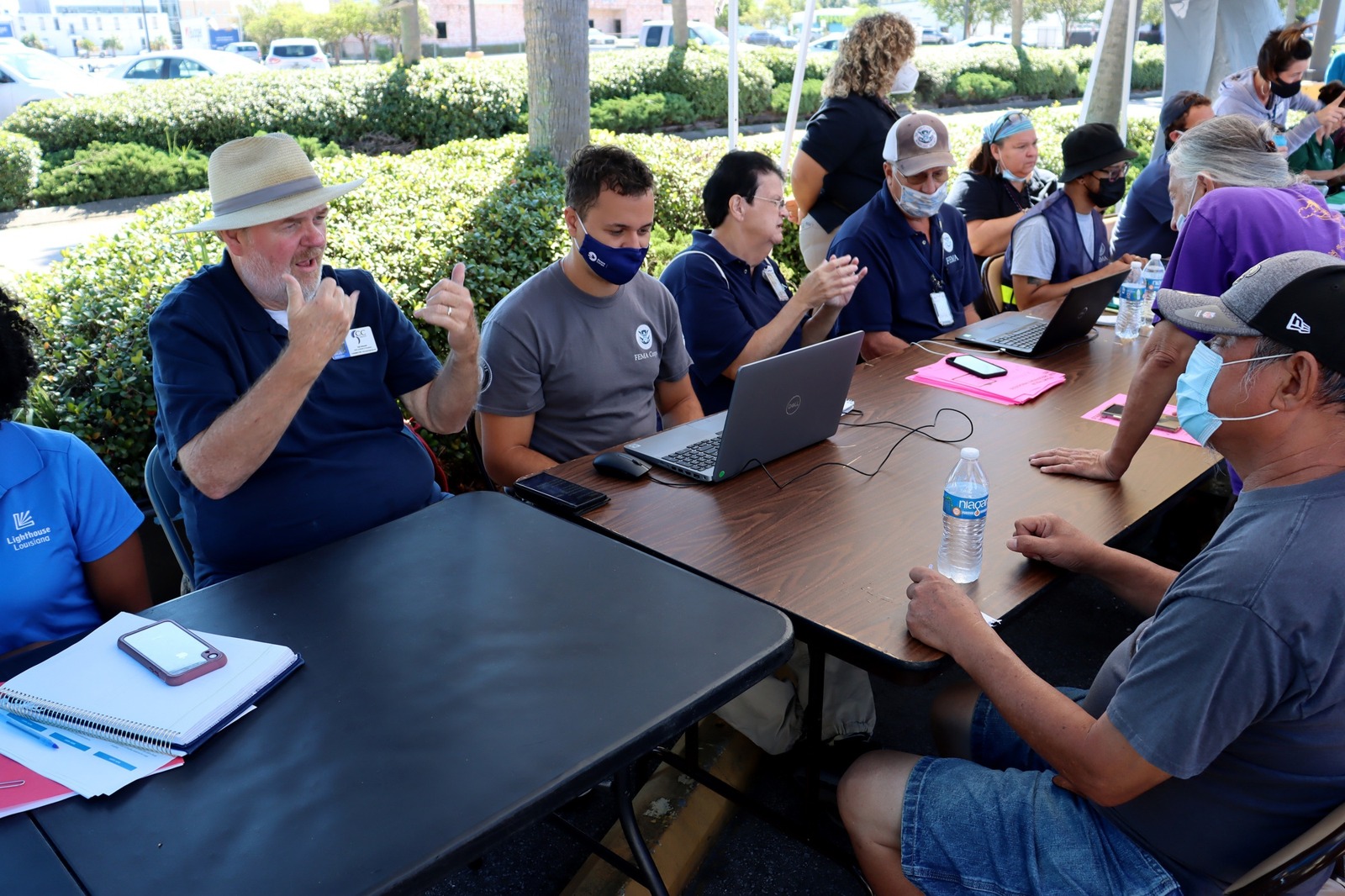 FEMA American Sign Language interpreters and assistance staff help deaf residents register for disaster assistance in Metairie, Louisiana, September 24, 2021. Archival emergency-accessibility context, not a Kern County EMPG-funded project. Keith Jones/FEMA, public domain.