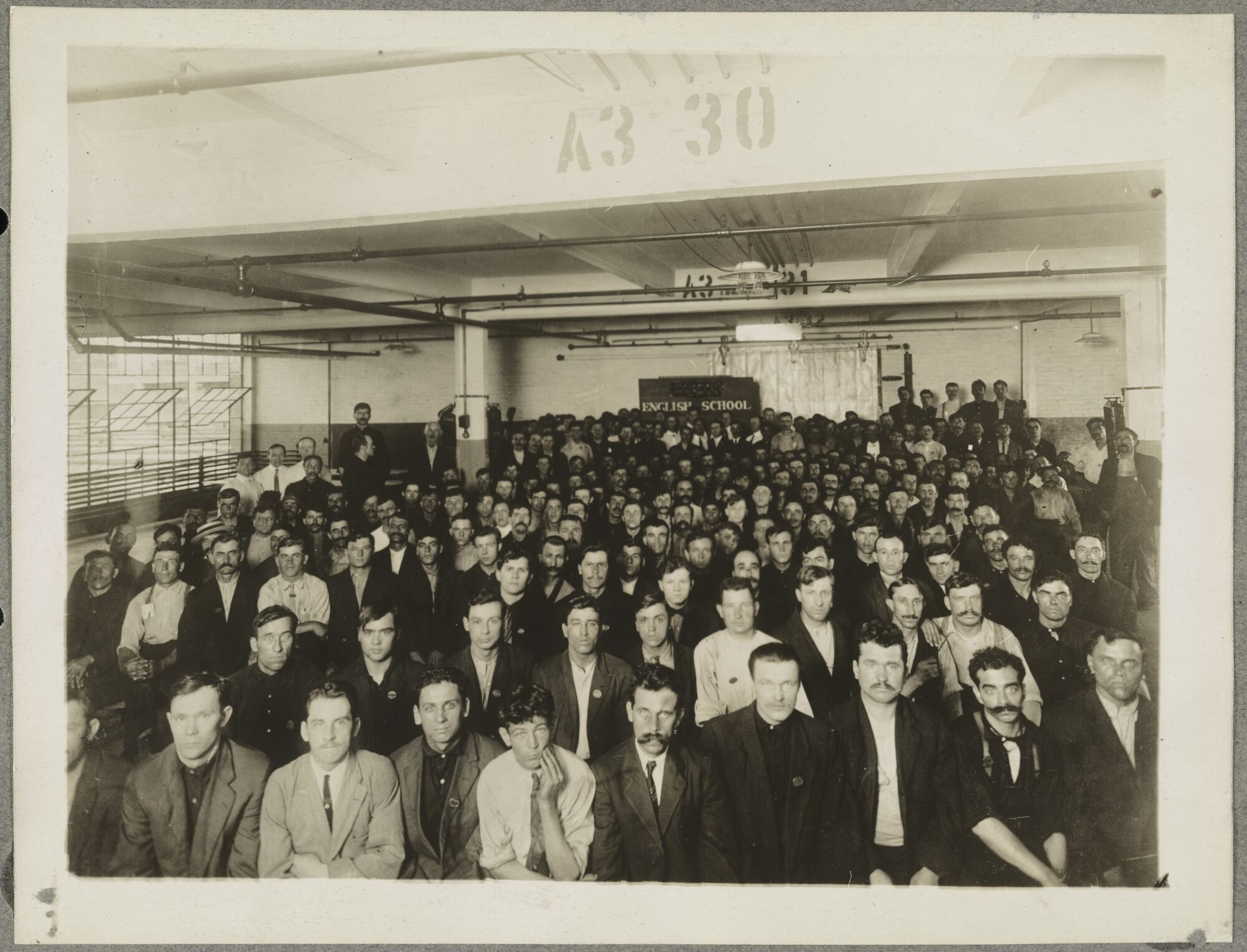 A 1909 Department of Labor Training Service English class at a Ford factory in Detroit. Historical workforce-training context only; not Kern High, a current participant or a funded program site. National Photo Company / Library of Congress, public domain.
