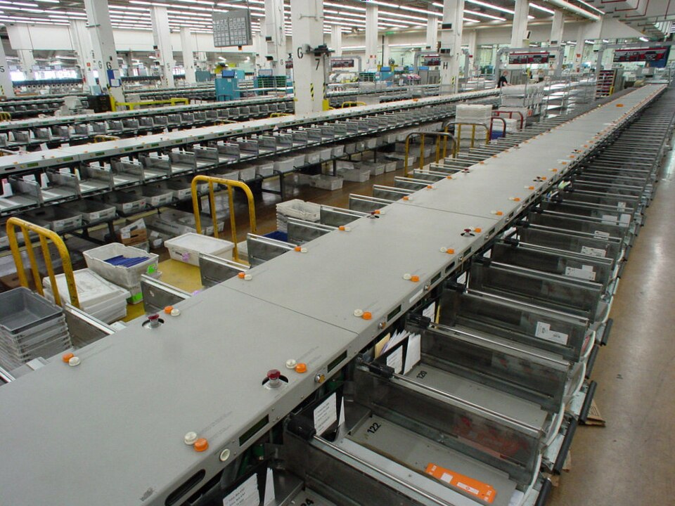 A mail sorting assembly line, photographed April 30, 2005. Generic archival context: the source does not establish a U.S. Postal Service location or identify these items as ballots. General mail-processing context; the source does not establish a USPS facility.
