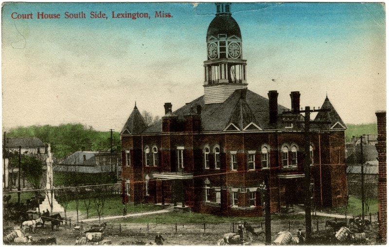 Historical postcard view of Holmes County Courthouse and a monument in Lexington, Mississippi; geographic context only.